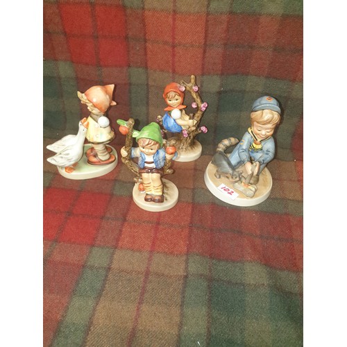 102 - A collection of 4 Assorted Hummel Figures