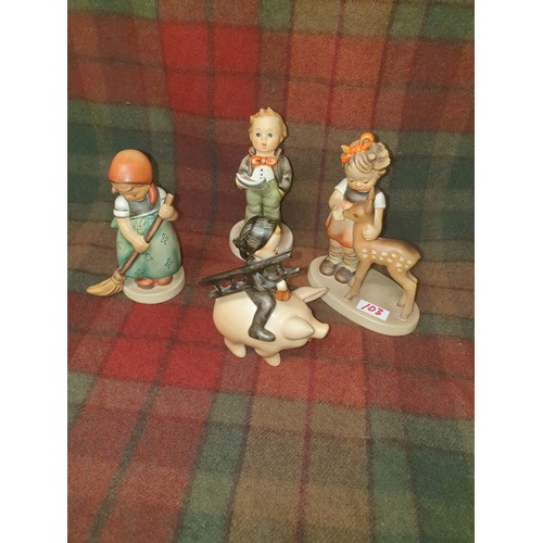 103 - A collection of 4 Assorted Hummel Figures