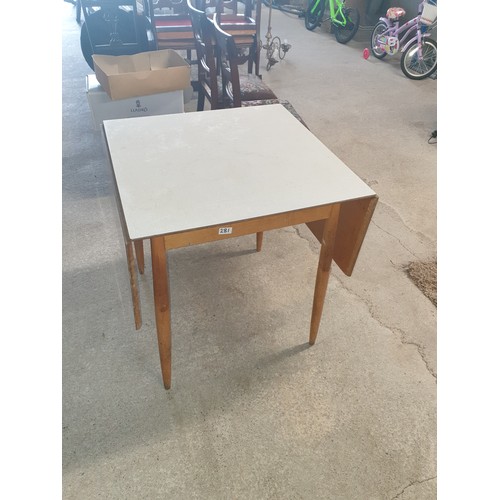 A Mid century Formica topped Drop Leaf Table