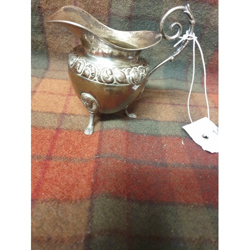 14 - A Foreign silver ornate cream jug [110grams]