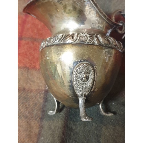 14 - A Foreign silver ornate cream jug [110grams]