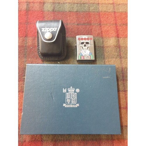 42 - A collectable Zippo Lighter In Leather Case & British Mint Coin Set