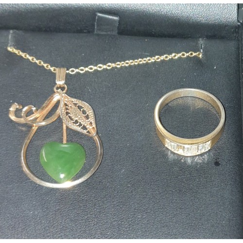 39 - A Collection of four Rings And Necklace With Pendant