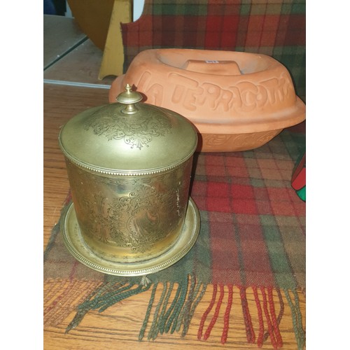 203 - A Shelf Of Collectables; Terracotta Tureen With Cover Tiffany Style Lamp Shade, EP Tea Caddy & Brass... 