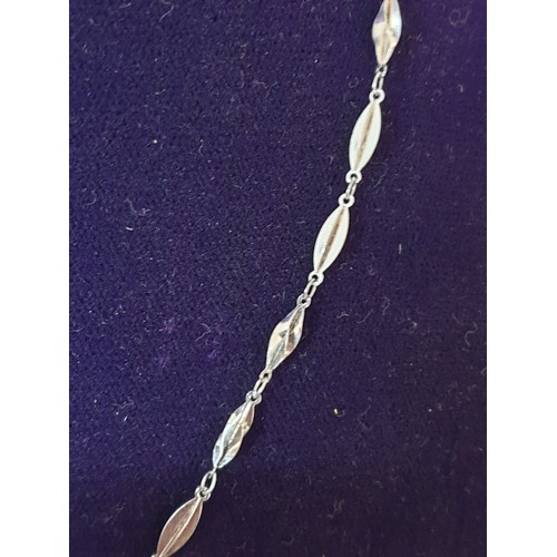 28 - A Silver Unusual Link Necklace and Matching Bracelet