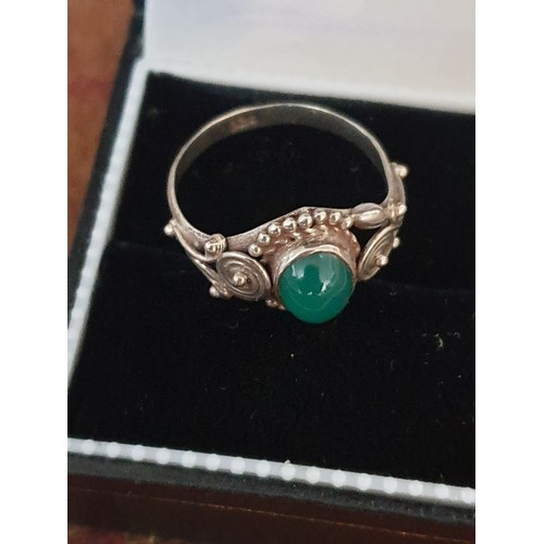 39 - A Silver Ring With Green Stone Centre