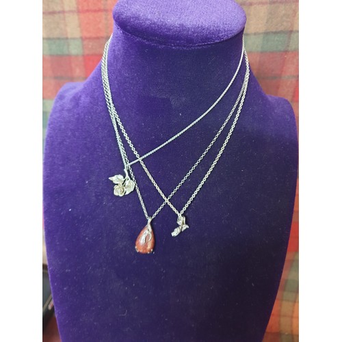 40 - A collection of 3 Silver Chains With Pendants; Agate design pendant, flower pendant & other