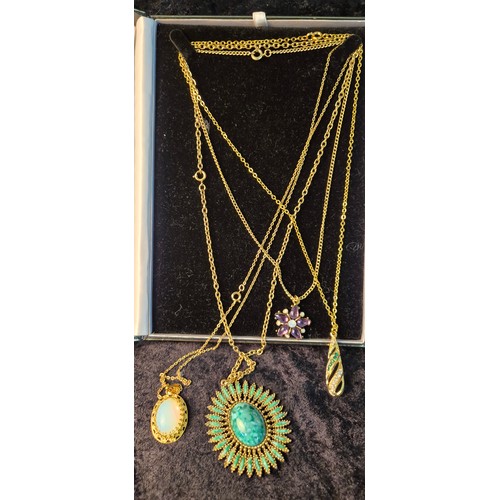 50G - A collection of four beautiful necklaces with pendants; opal style pendant with chain, green stone s... 