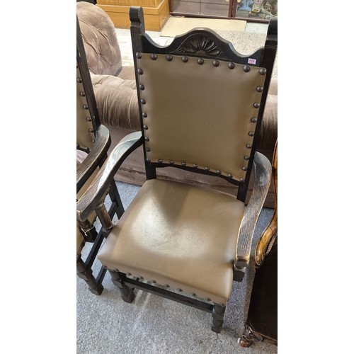 239 - A Pair of 1900s Oak arm chairs with leather upholstery