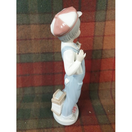 139 - Lladro Boy With Bib and Brace Dungarees Hat And Accordion At His Feet 23 cms Tall