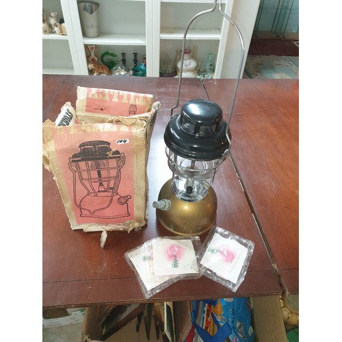 104 - A Tilley Storm Lamp With 3 Spare Wicks And Original Box