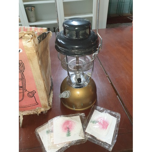104 - A Tilley Storm Lamp With 3 Spare Wicks And Original Box
