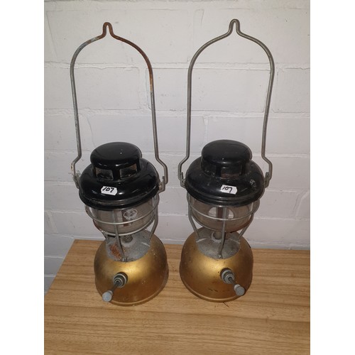 107 - A collection of two vintage Storm Lamps