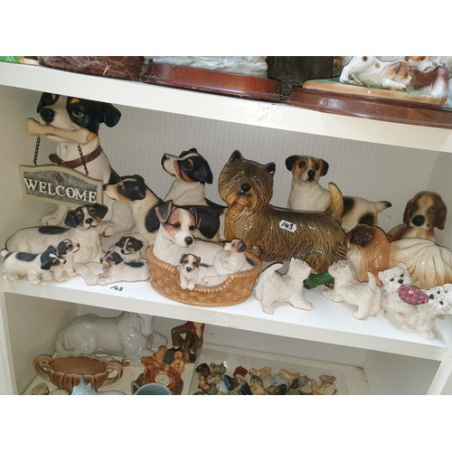 143 - A Shelf Of Assorted Dog Figures etc