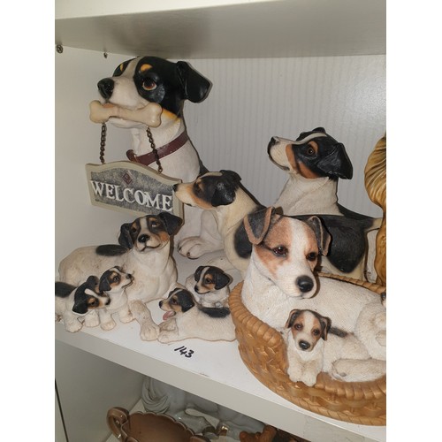 143 - A Shelf Of Assorted Dog Figures etc