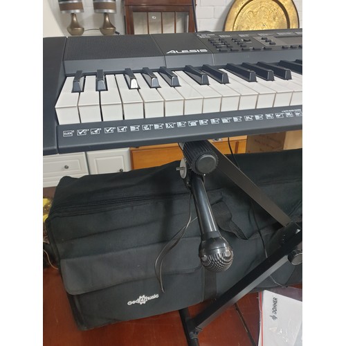187 - Alesis Keyboard With Stand Ear Phones And Microphone, With Carry Bag etc