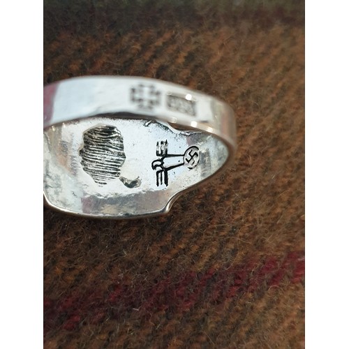 22 - A German Silver Ring With Swastika Emblem To Inside Of Band And Skull And Crossbones To Front