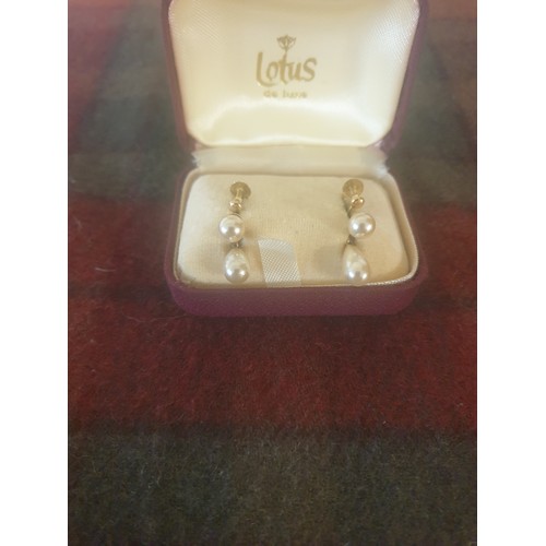 6 - A Pair of 9ct Gold 375 hall marked pearl set earrings