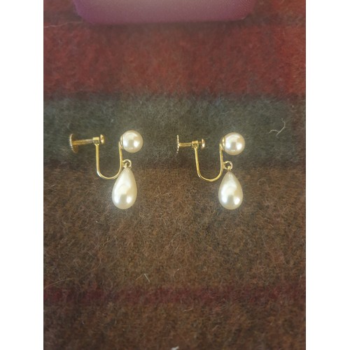 6 - A Pair of 9ct Gold 375 hall marked pearl set earrings