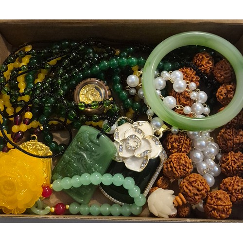 45 - Box of Oriental jewellery. Amulets necklaces, Jade Chinese hardstone bangle & chinese carved bracele... 