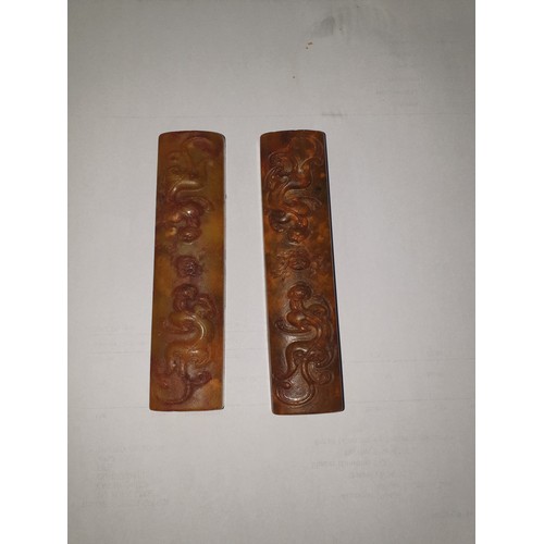 50 - Pair of Oriental soap stone panels in fitted silk box.