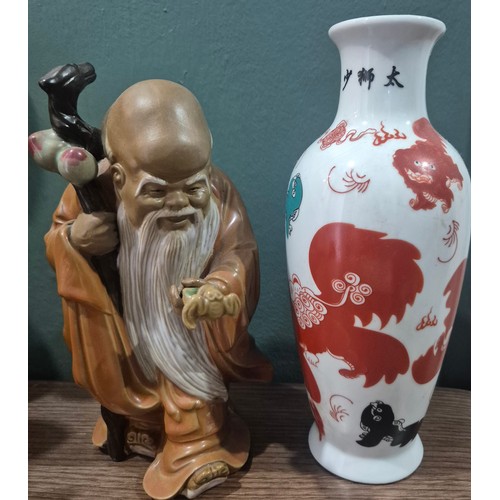 51 - Large Chinese sculpture of a monk together with oriental vase.
