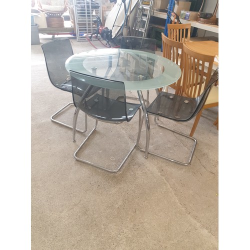 285 - Mid century  Style Glass And Chrome Rocket Style Legs Table With 4 Chrome Chairs. Very stylish.