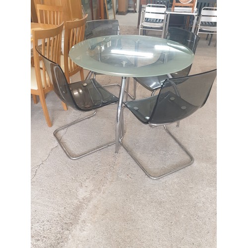 285 - Mid century  Style Glass And Chrome Rocket Style Legs Table With 4 Chrome Chairs. Very stylish.