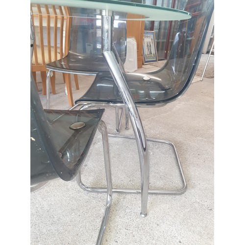 285 - Mid century  Style Glass And Chrome Rocket Style Legs Table With 4 Chrome Chairs. Very stylish.