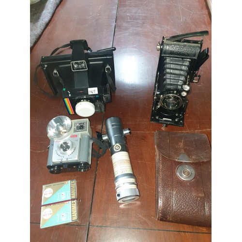 147 - Shelf Of Vintage Cameras To Include Voightlander Folding Bellows Camera & others.