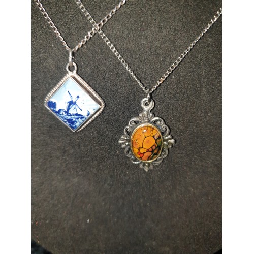 26 - 2 Silver Chains And Scottish Stone Pendant along With Delft Pendant