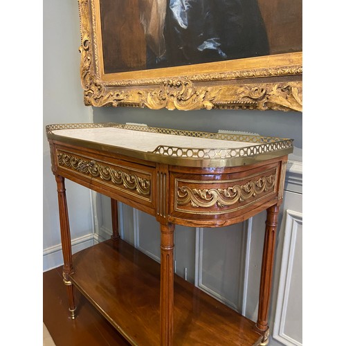 57 - A Louis XVI ormolu and brass-mounted mahogany console desserte. Wrap-around floral gilt-frieze panel... 