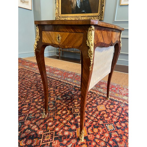 64 - A Louis XV ormolu-mounted bois satine and fruitwood marquetry writing table. Adjustable writing slid... 