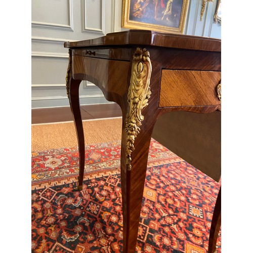 64 - A Louis XV ormolu-mounted bois satine and fruitwood marquetry writing table. Adjustable writing slid... 