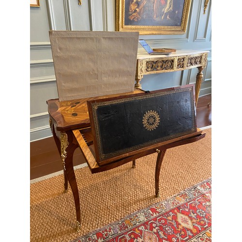 64 - A Louis XV ormolu-mounted bois satine and fruitwood marquetry writing table. Adjustable writing slid... 