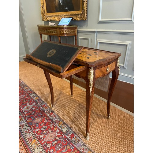 64 - A Louis XV ormolu-mounted bois satine and fruitwood marquetry writing table. Adjustable writing slid... 