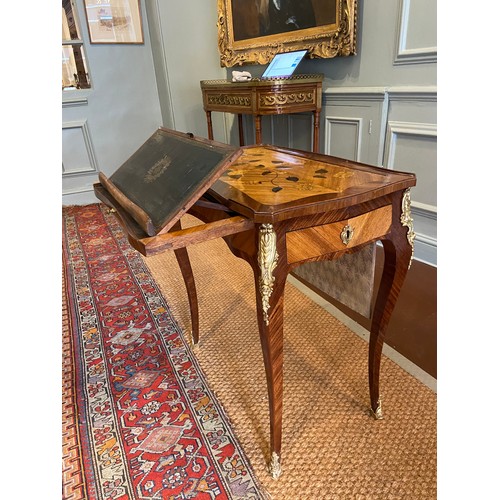 64 - A Louis XV ormolu-mounted bois satine and fruitwood marquetry writing table. Adjustable writing slid... 