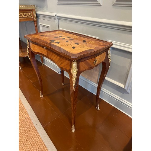 64 - A Louis XV ormolu-mounted bois satine and fruitwood marquetry writing table. Adjustable writing slid... 