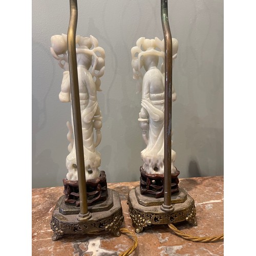 75 - Pair of 19th century Chinese White Jade figures of Lan Ts'ai-ho set upon carved wood bases, set upon... 