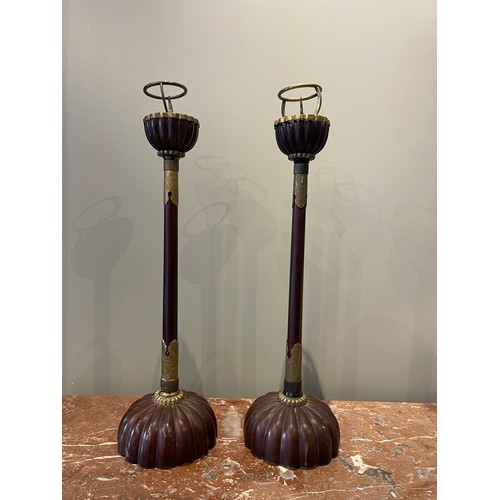 76 - A pair of lacquered wood candlesticks (18th century), each with a large, solid hemispherical base th... 