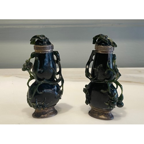 A pair of Qing Dynasty Chinese carved high relief jade ‘double gourds’ with creeping foliate, one with a spider and a bee and the other with spider. Finely worked in the round. With finely worked gilded silver mountings. The bottom has a striker. Probably 17th century. Converted into lighters by Maison Maquet in mid 19th century. 