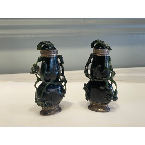 79 - A pair of Qing Dynasty Chinese carved high relief jade ‘double gourds’ with creeping foliate, one wi... 