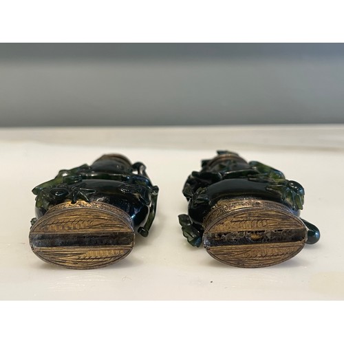 79 - A pair of Qing Dynasty Chinese carved high relief jade ‘double gourds’ with creeping foliate, one wi... 