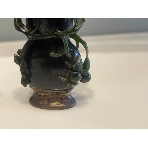 79 - A pair of Qing Dynasty Chinese carved high relief jade ‘double gourds’ with creeping foliate, one wi... 