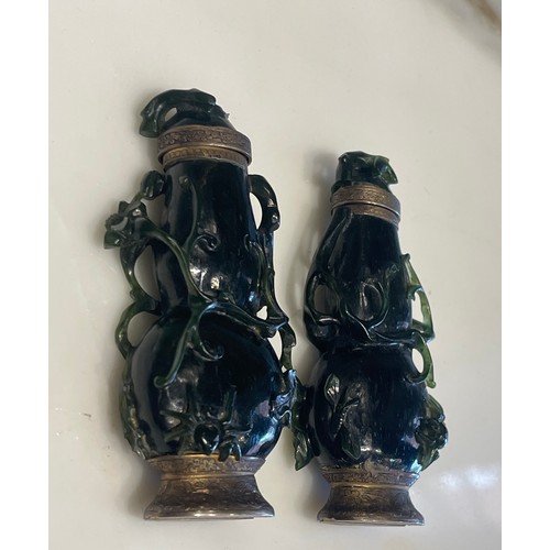 79 - A pair of Qing Dynasty Chinese carved high relief jade ‘double gourds’ with creeping foliate, one wi... 