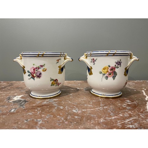 81 - A pair of Sevres-style vases with markings. Painted floral decorations and gilding. Each with two ha... 