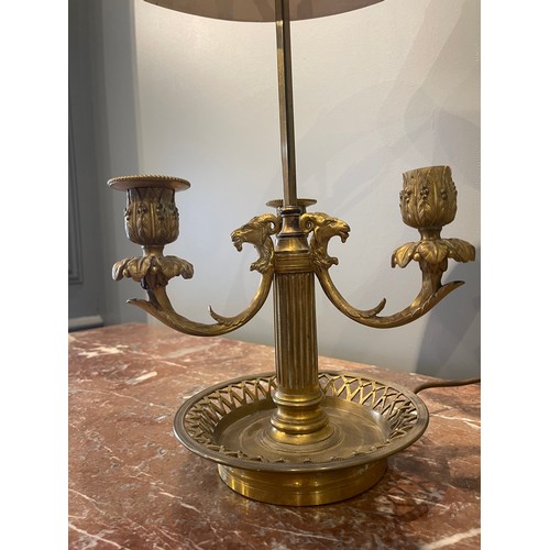 84 - A Louis XVI gilt bronze bouillotte (late 18th century). Pierced rim, fluted column-base, triple-bran... 