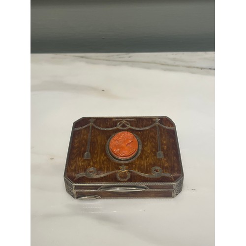 92 - An antique silver and enamel snuff box of rectangular form with canted corners decorated with amber ... 