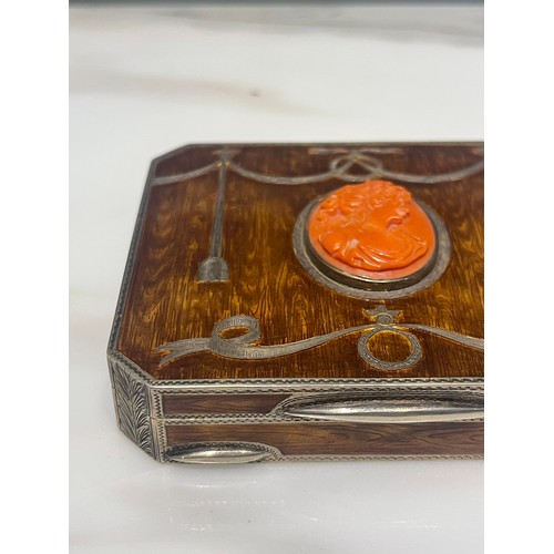 92 - An antique silver and enamel snuff box of rectangular form with canted corners decorated with amber ... 