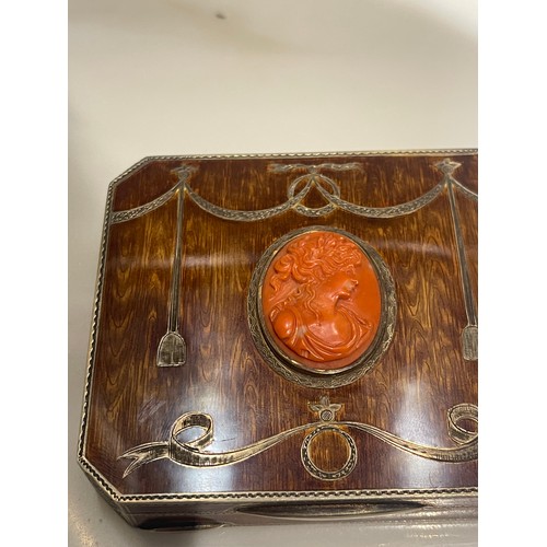 92 - An antique silver and enamel snuff box of rectangular form with canted corners decorated with amber ... 